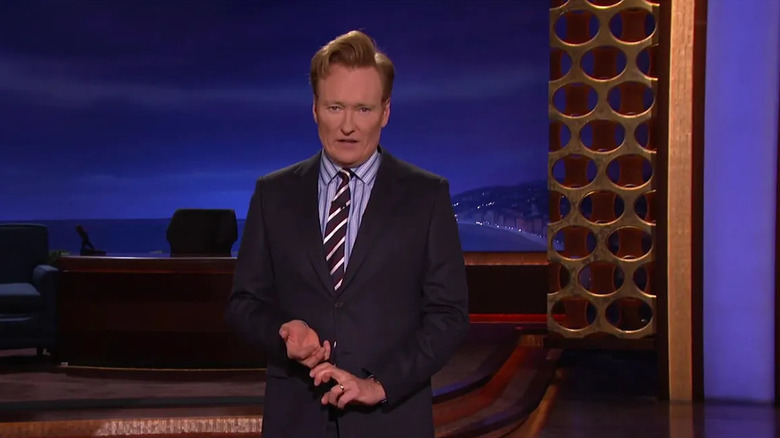 Conan giving monologue in front of set