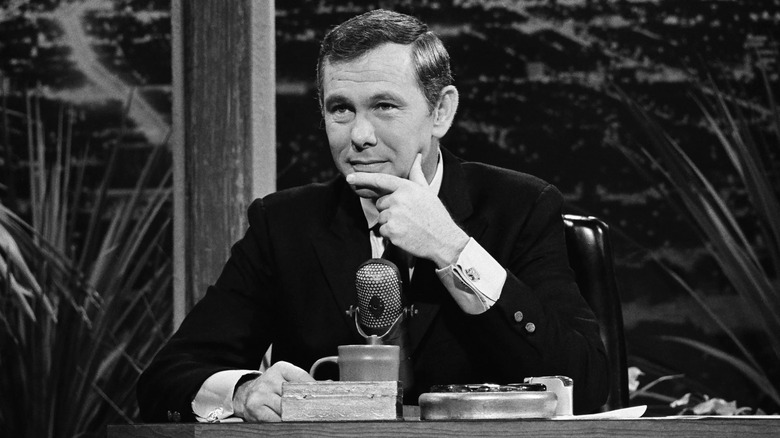 Johnny Carson behind his desk