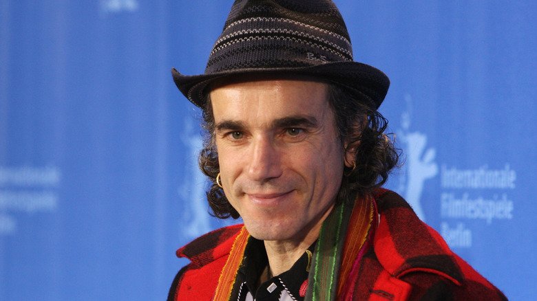 Daniel Day-Lewis in a hat and red flannel