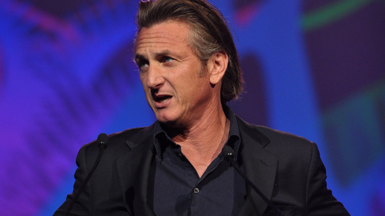 Sean Penn talking into a microphone