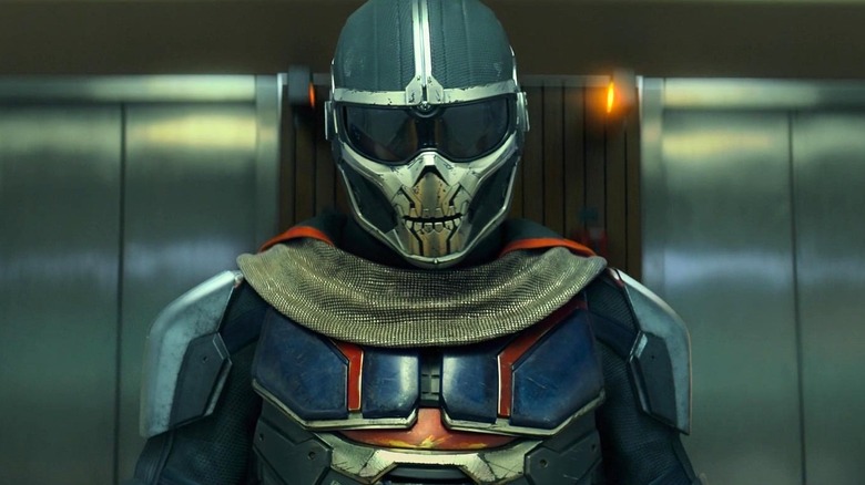 Taskmaster stands in front of elevator doors in "Black Widow" (2021)