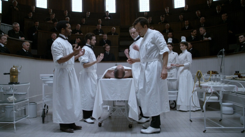 Thackery and his team prepping a patient in the operating theater in The Knick (2014)