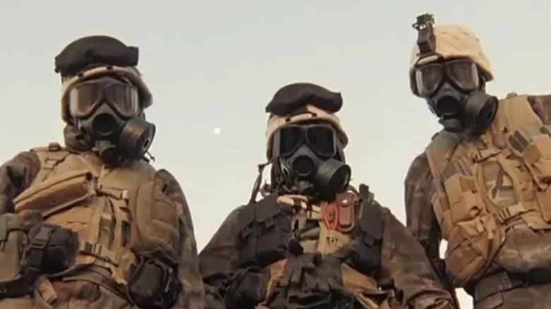 Three people in gas masks and military uniforms on "Generation Kill" (2008)