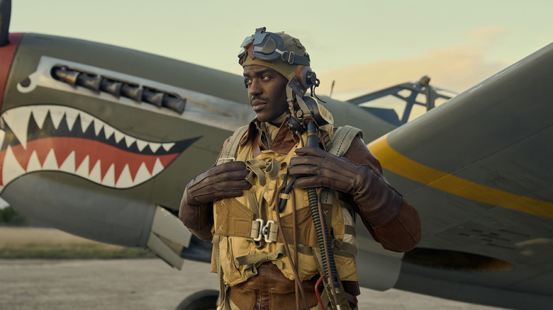 Robert Daniels standing in front of a plane on "Masters of the Air" (2024)