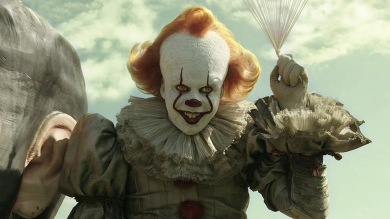 Pennywise holding balloons in 