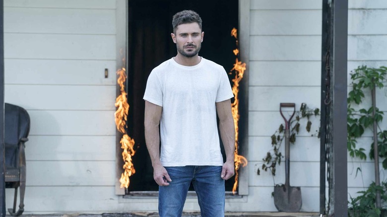 Andrew "Andy" McGee standing in front of a flaming doorway in Firestarter (2022)