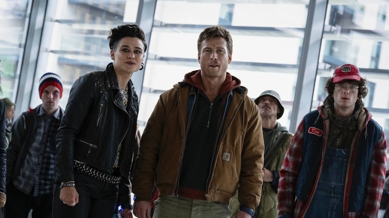 Ben Richards standing with other Running Man contestants in The Running Man (2025)