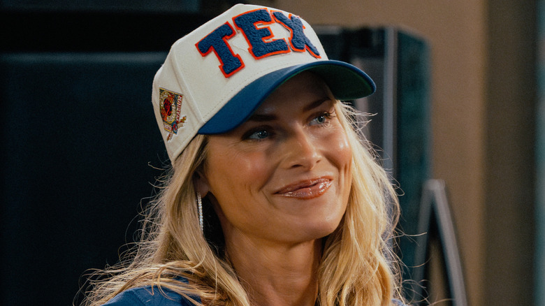 Angela smiles in her Texas Christian University hat in 