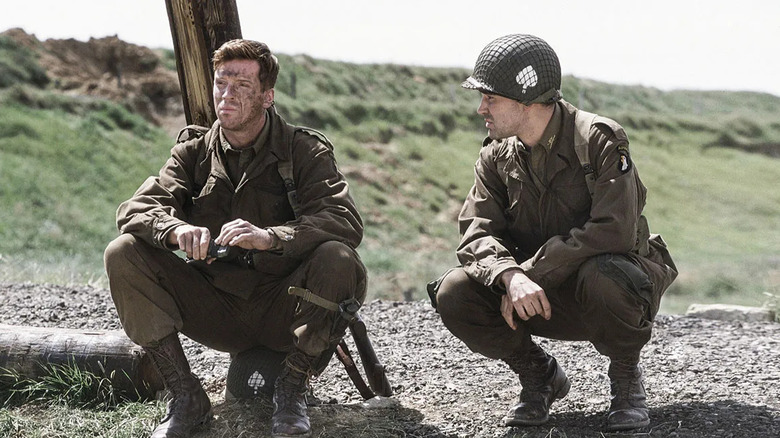Dick and another soldier sitting in silence in Band of Brothers