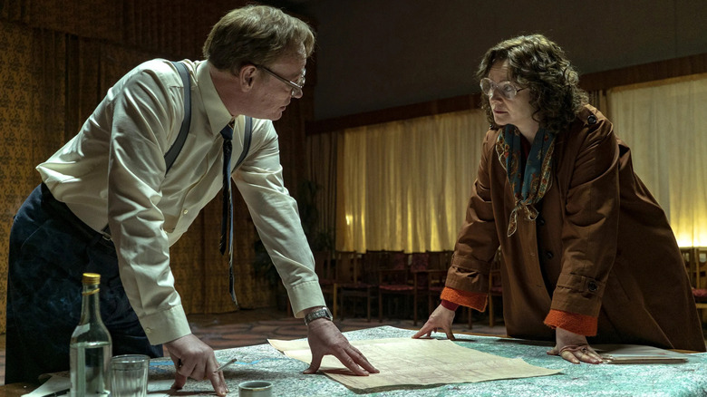 Valery and Ulana looking at plans in Chernobyl