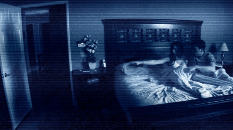 Home video footage of two people in bed from "Paranormal Activity"