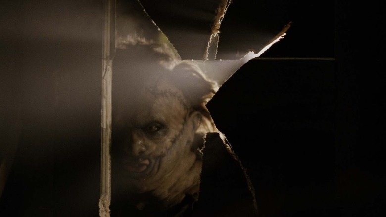 Leatherface poking his head in in "The Texas Chainsaw Massacre"