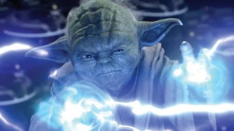 Yoda grimaces as he defends against blue Force lightning in Star Wars Episode II: Attack of the Clones
