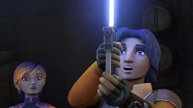 Ezra Bridger lighting up his blaster lightsaber on Star Wars Rebels