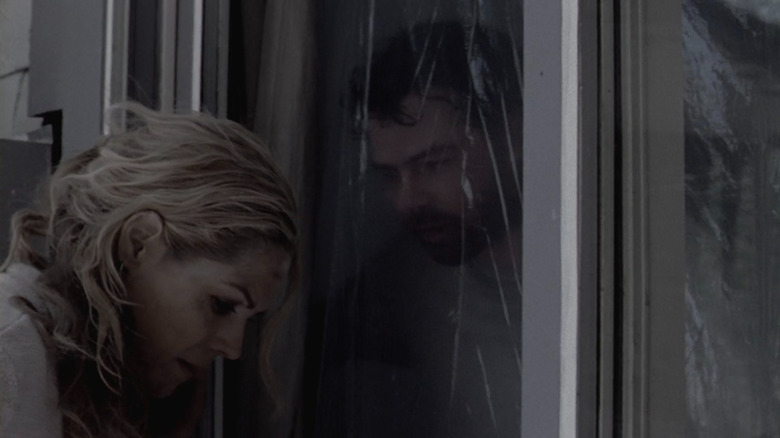 Brad talking to Lexi through glass door in Right at Your Door