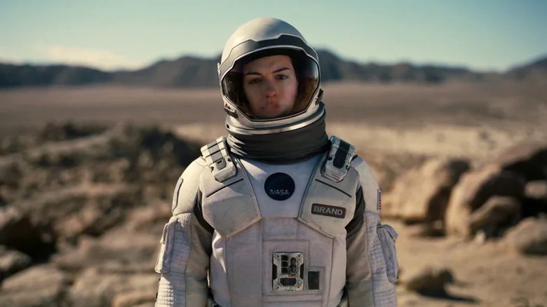 Brand wearing a white space suit on Interstellar