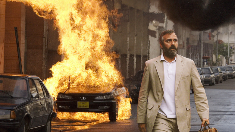 Bob walking in front of an exploding car in Syriana