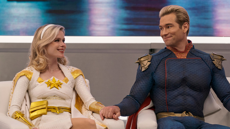 Starlight and Homelander smiling and holding hands on The Boys