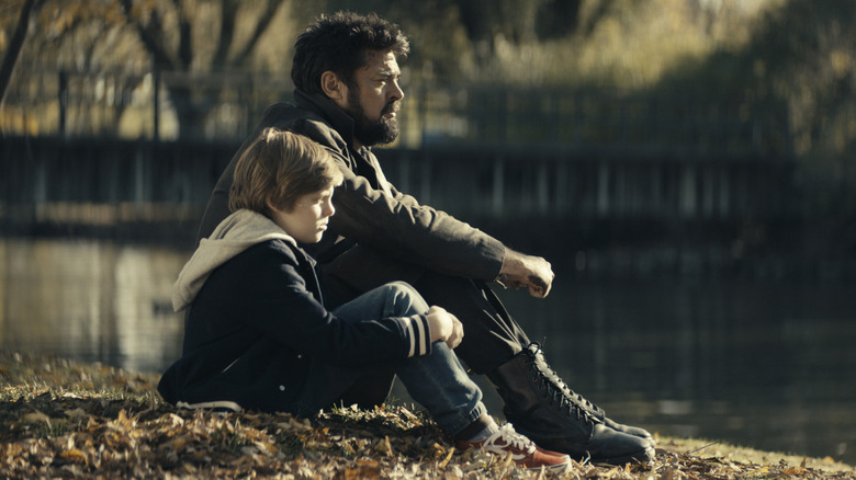 Billy and Ryan Butcher sitting by water on The Boys
