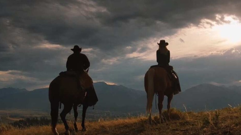 Rip (Cole Hauser) and Beth (Kelly Reilly) riding horses on "Yellowstone."