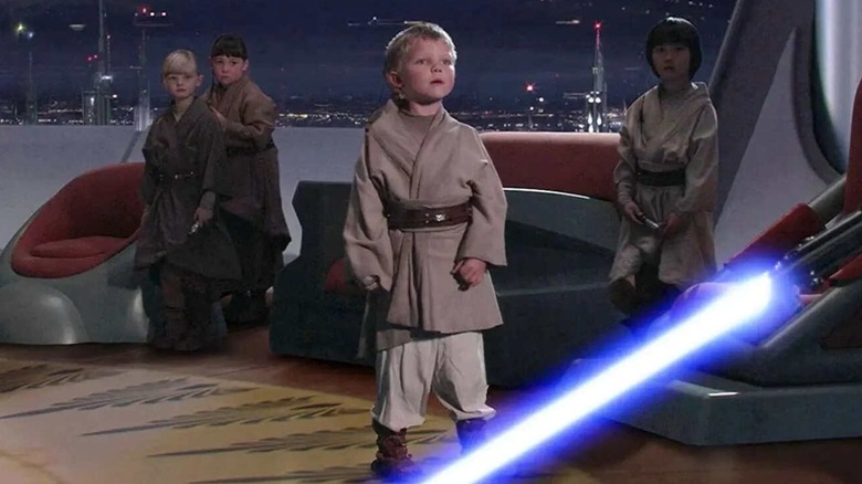 The Jedi Younglings stand before Darth Vader who ignited his lightsaber in "Revenge of the Sith"