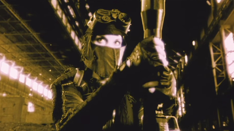 Ash dressed in tactical gear and face mask in "Avalon" (2001)