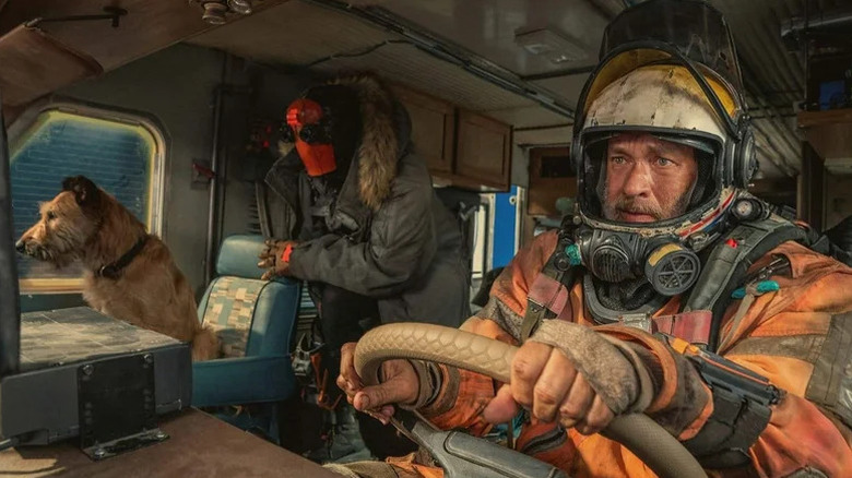 Goodyear, Jeff, and Finch in a car in "Finch" (2021)