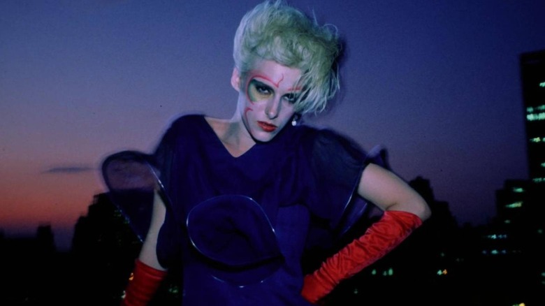 Margaret posing against the New York skyline in Liquid Sky