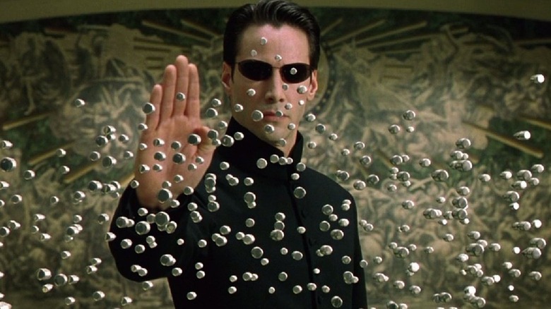 Neo blocks bullets in 