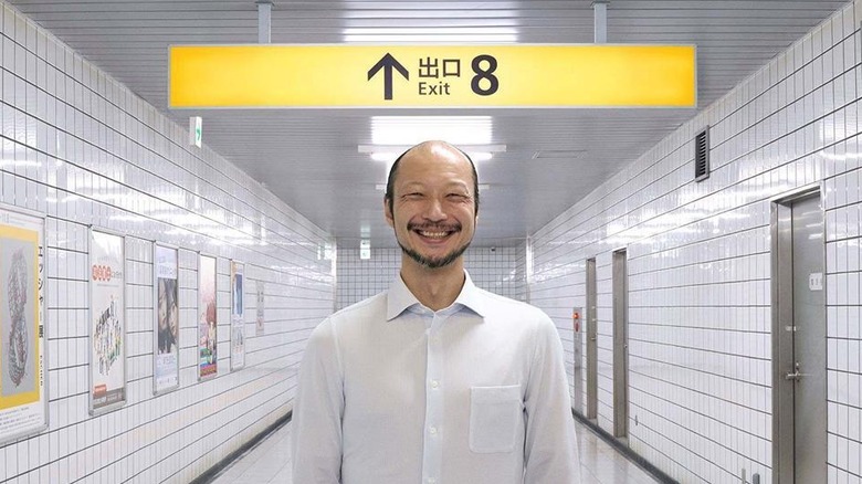 The Smiling Man in the subway in Exit 8 (2026)