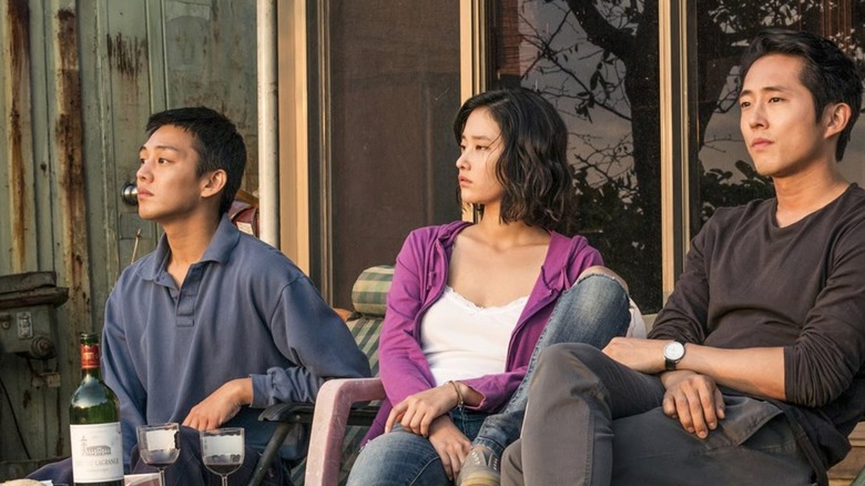 The three leads of Burning sitting and enjoying the outdoors (2018)