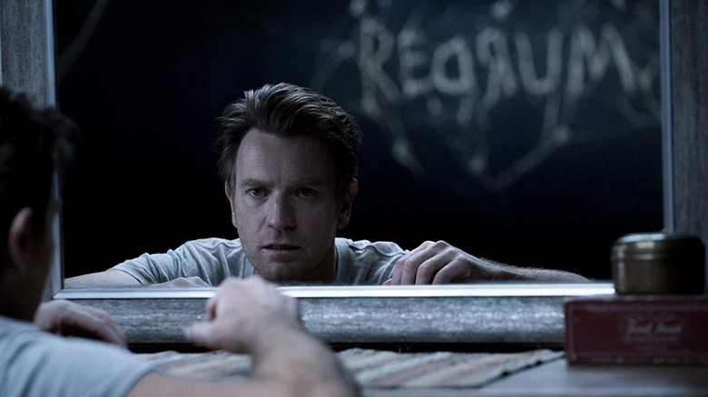 Danny Torrance noticing familiar words etched into his wall in Doctor Sleep (2019)