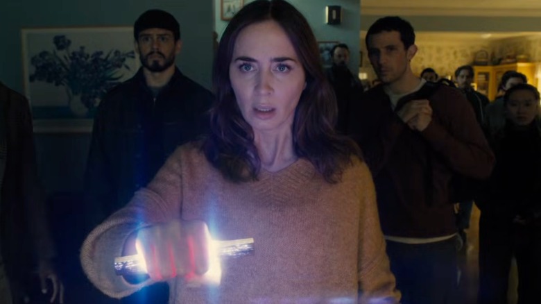 Margaret holding The Device with Santiago and Daniel behind her in Disclosure Day