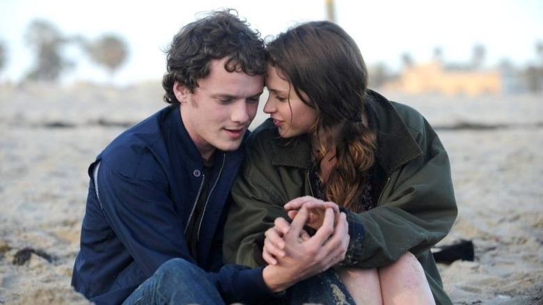 Jacob and Anna cuddling on the beach in Like Crazy