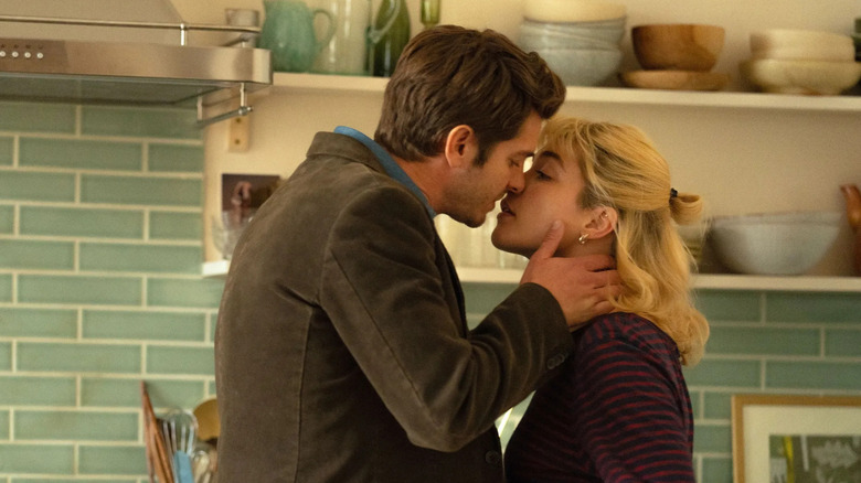 Tobias and Almut about to kiss in the kitchen in We Live in Time