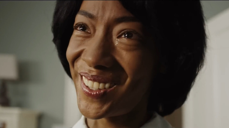 Georgina smiling uncomfortably at Chris Washington in "Get Out" (2017)