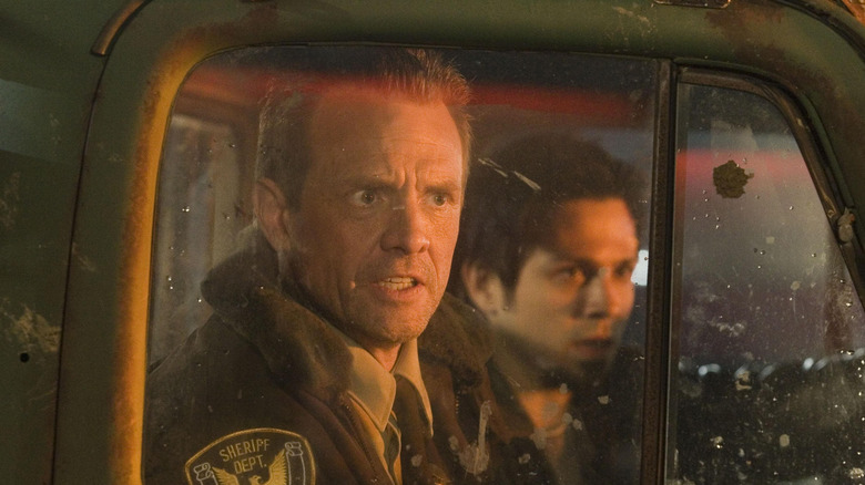Sheriff Hague snarling in the cab of a truck in Planet Terror (2007)
