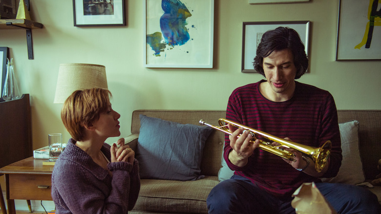 Nicole watching Charlie open a trumpet in Marriage Story