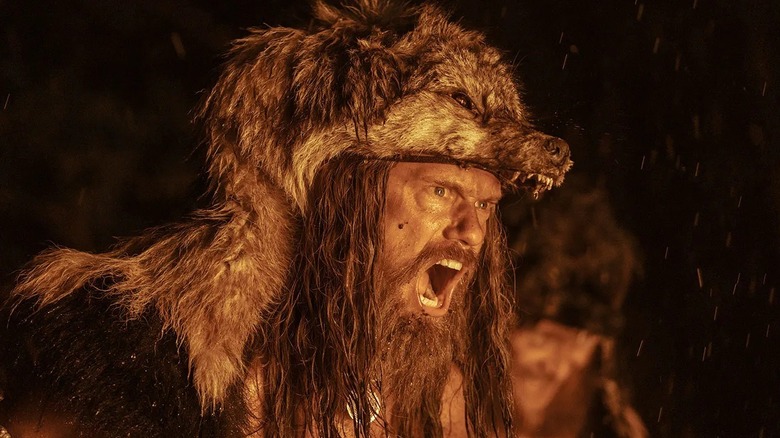 Amleth screaming against a crackling fire in "The Northman" (2022)