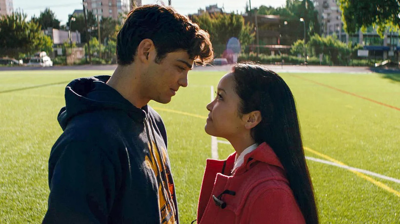 Peter and Lara-Jean looking at each other on the field in To All the Boys I've Loved Before