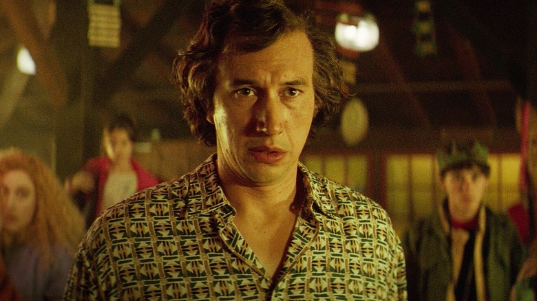 Jack Gladney standing in front of his family in White Noise (2022)