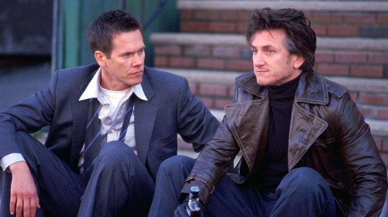 Sean and Jimmy sitting on steps in "Mystic Riber."