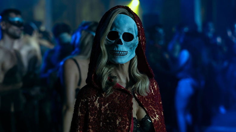 A woman wearing a skull mask in The Fall of the House of Usher