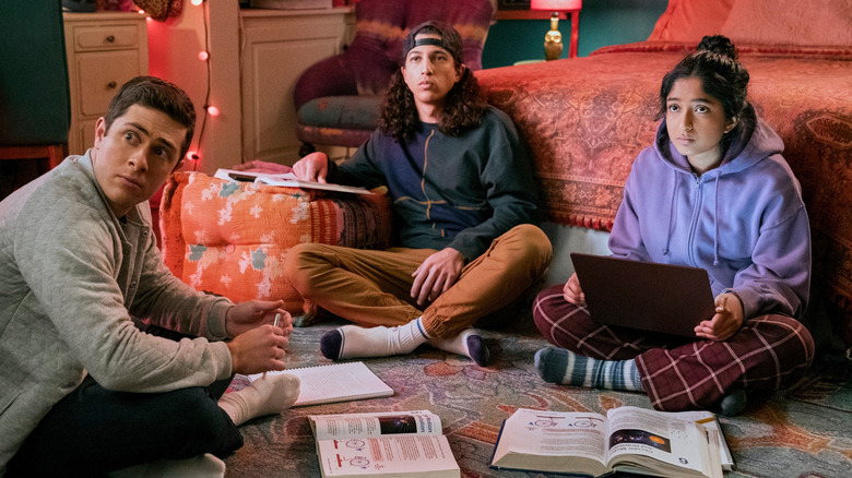 Devi, Ben, and Trent studying together on the bedroom floor in "Never Have I Ever" (2020-2023)
