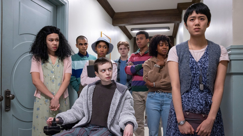 The members of the Midnight Club standing together in a hallway in "The Midnight Club" (2022)