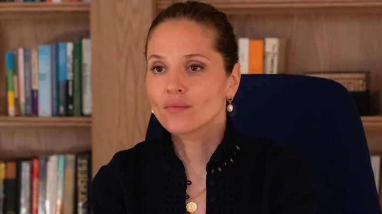 Heather Glenn sitting at her desk in Daredevil: Born Again