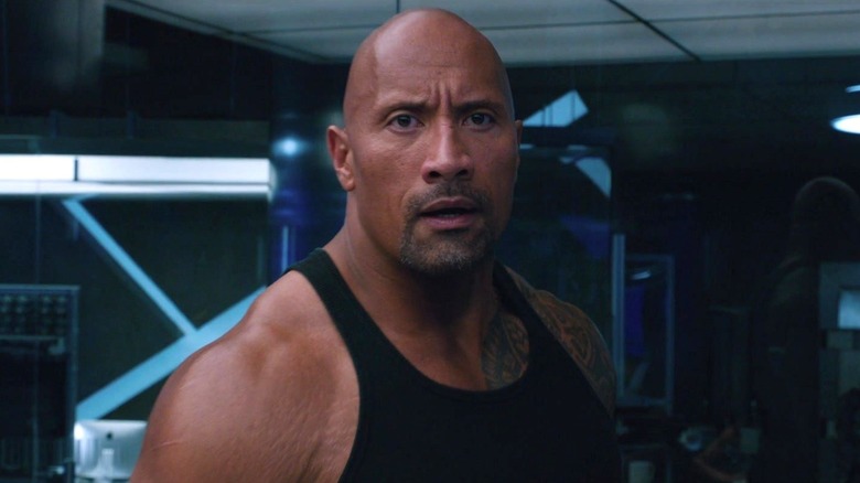 Dwayne Johnson's Luke Hobbs wearing a black vest in The Fate of the Furious