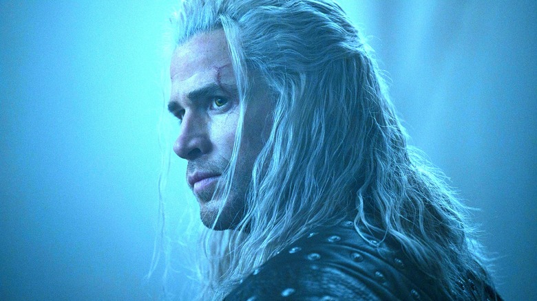 Liam Hemsworth's Geralt of Rivia looking over his shoulder in The Witcher