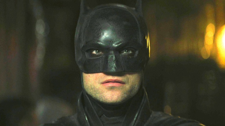 Robert Pattinson's Batman staring ahead in The Batman