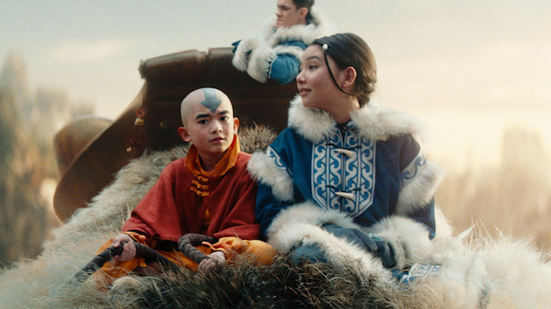 Aang and friends riding in the sky on Appa in "Avatar: The Last Airbender" (2024)